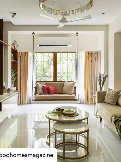 Good Homes Magazine captured the essence of our 'Calm Abode' project perfectly. This wide shot shows how we balanced a neutral sofa and a traditional swing with a modern layout to create a living room that is both serene and family-friendly.