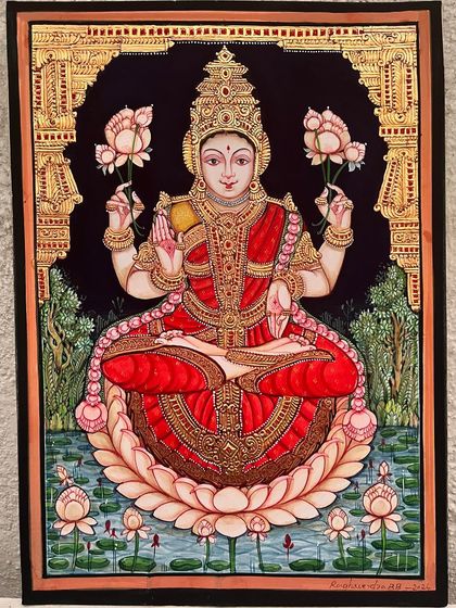A beautiful depiction of Goddess Lakshmi seated on a lotus in a lush, green pond. Dressed in a traditional red saree, she embodies prosperity and abundance, making this a perfect painting for Diwali or any auspicious occasion.