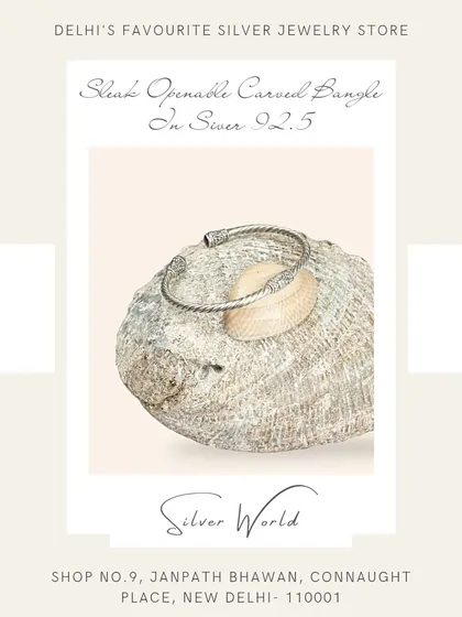 A sleek, openable carved bangle in pure 92.5 silver. Its minimalist design has a subtle texture, making it a sophisticated everyday accessory.