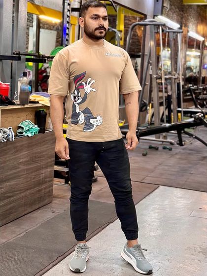 Even a strength coach can have a bit of fun. Rocking a Bugs Bunny shirt in the gym.