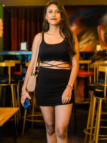 A guest posing at the bar.