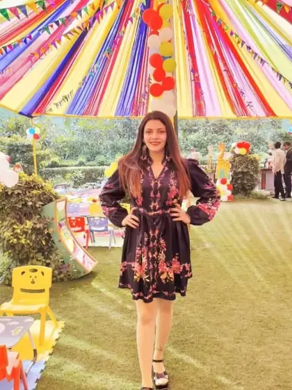 The emcee posing at a colorful outdoor kids' carnival I organized. Having a dedicated host keeps the energy high and ensures all the children are included in the fun.