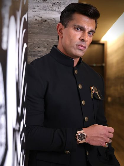 A color portrait of Karan Singh Grover, highlighting the details of his outfit and his confident demeanor. This is a perfect example of a strong headshot for an actor or professional.