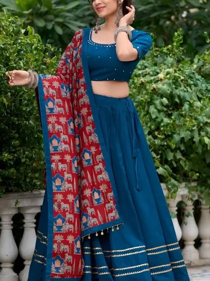 For a more modern and elegant look, this solid blue chaniya choli is perfect. It’s paired with a beautiful printed dupatta featuring traditional motifs, giving you a unique style that stands out from the crowd.