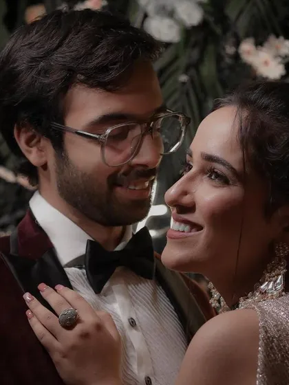 A beautiful candid moment where the couple shares a smile. These unposed shots often become the most cherished memories from a reception, showing the real joy and love between two people.