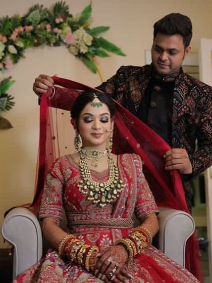 A sweet moment between the bride and groom. Her makeup is soft and romantic, perfect for these candid shots.