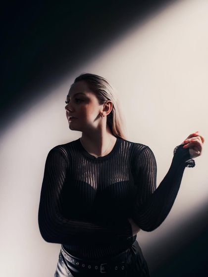 A portrait using dramatic lighting to create a sense of movement and shadow. This was used to announce my return to India for a new season of gigs.