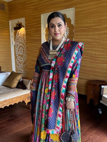 A full view of the Navratri look. The braided hairstyle complements her colorful, traditional outfit beautifully.