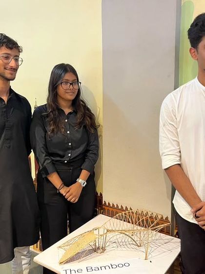 My architecture students standing proudly with their bamboo structure model. Guiding them to explore sustainable materials and innovative designs is a core part of my teaching philosophy.