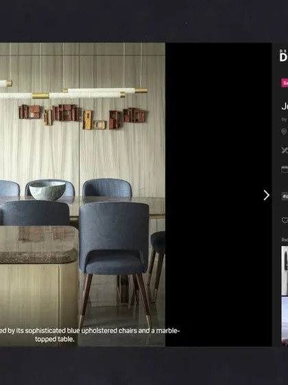 Our Jor Bagh Residence dining area featured on Design Dekko. The space is marked by its sophisticated blue chairs and a marble-topped table, creating an elegant setting for meals.
