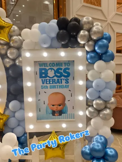 A close-up of the personalized and lighted welcome sign for the Boss Baby party.