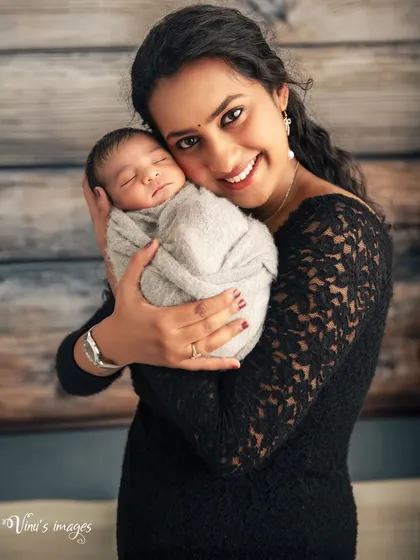 The purest love. In this simple, intimate portrait, a mother holds her newborn for the first time. I focus on capturing that immediate, powerful connection and the peaceful expression of a baby feeling safe and loved.
