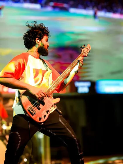 Another action shot of our bassist, showcasing the energy and movement we bring to the stage.