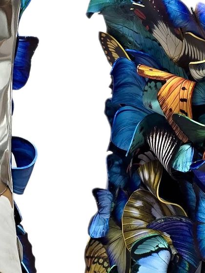 A sneak peek from the studio, working on a new piece that layers blue-toned butterflies on a reflective steel base.