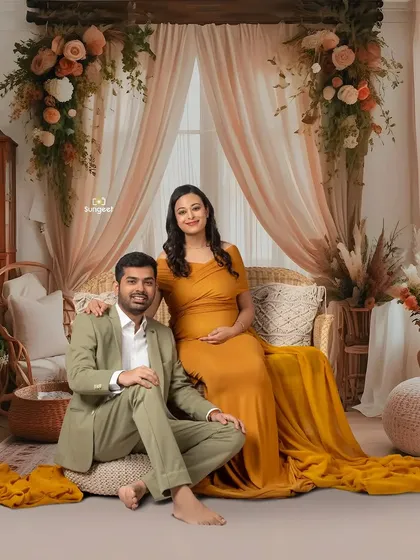 A relaxed and happy couple's portrait in our warm, earthy boho setup. Their coordinated outfits complete the beautiful, natural look.
