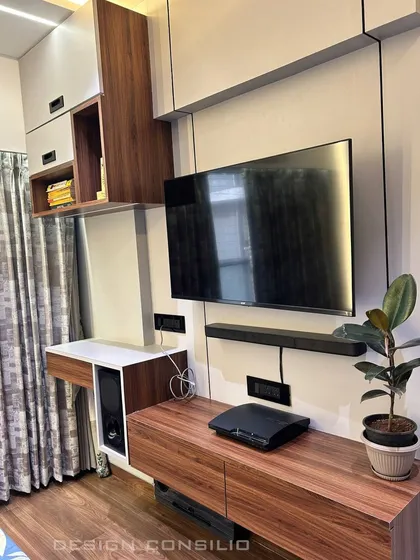 A compact TV unit that also serves as a study or dressing table. We design multi-functional furniture to make the most of the available space in smaller rooms.