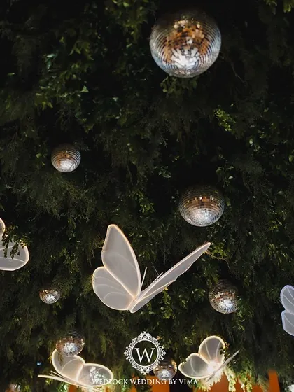 We brought an enchanted forest to life for this Sangeet night. The ceiling was a canopy of lush greenery, sparkling disco balls, and glowing LED butterflies, creating a dreamlike atmosphere for a night of dancing.