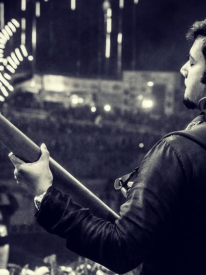 A powerful black and white shot of our bassist from behind, looking out at the massive crowd at Parab Festival.