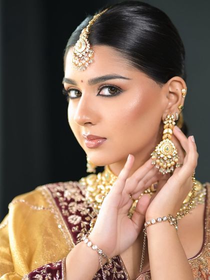 A soft, minimal, and effortlessly chic bridal look. We focused on clean lines, a sharp wing, and radiant skin to let the bride's natural beauty and stunning jewelry shine.