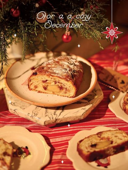 Slices of our Christmas Stollen on a festive table, ready to be shared with loved ones.