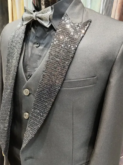 Perfect for a cocktail night or reception, this three-piece suit combines classic tailoring with a touch of glamour. The sparkling sequin lapels and matching bow tie ensure you will stand out from the crowd.