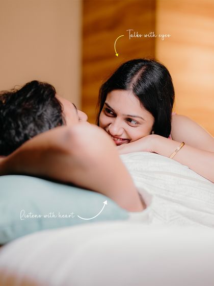 She listens with her heart, he talks with his eyes. A tender moment shared in the comfort of their bed, highlighting their deep emotional connection.