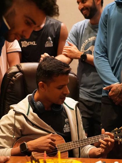 The players gather around during a team celebration. It's these informal moments that forge the strongest bonds within a squad.