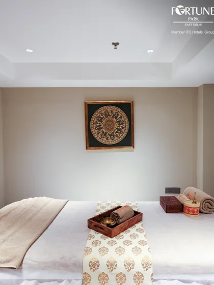A clean, prepared massage bed awaits you. The simplicity of the room is intentional, creating a distraction-free zone for your mind and body to rest.