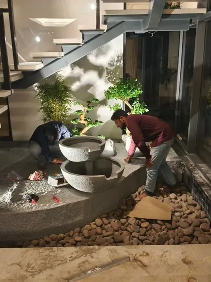 Our expert team handles the entire turnkey installation from start to finish. This behind-the-scenes look shows the careful construction process, ensuring a flawless and durable foundation for your bespoke indoor water feature.