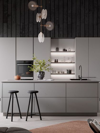 The Minimalism of Grey. This sleek ensemble integrates grey concrete and greige laminate for a sophisticated look, with an island that serves as a central hub for culinary creativity.