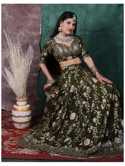 A confident and direct portrait from the same series. The lighting is carefully placed to make the silver embroidery on the lehenga shimmer.