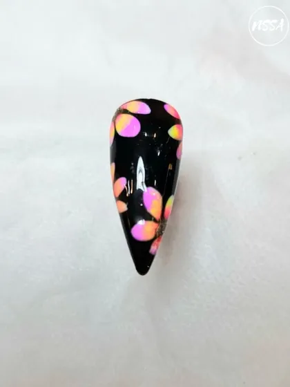 This vibrant, abstract dotting art on a black base is a great example of student creativity. They learn to play with color and pattern to create bold designs.