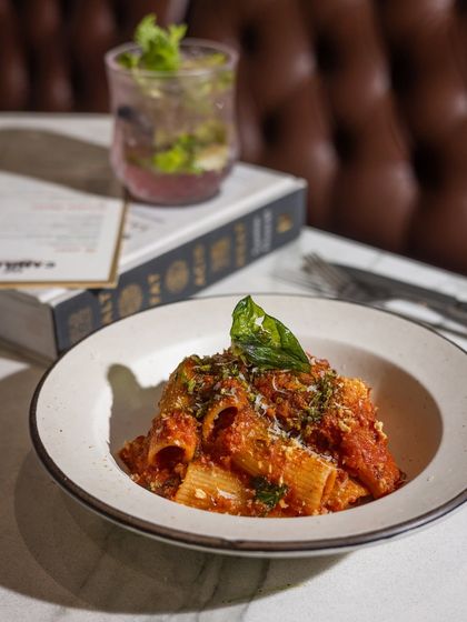 It’s the kind of bowl that belongs at a table full of laughter. This Rigatoni is tossed in a slow-cooked tomato sauce with a touch of heat and a sprinkle of cheese and herb crumbs.