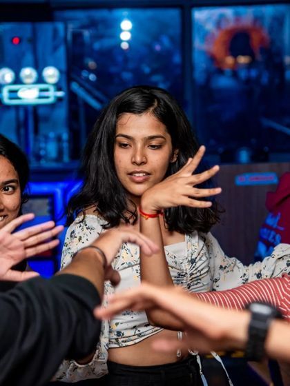Friends dancing together and sharing a laugh. My pub is all about creating a space for good times and great company.