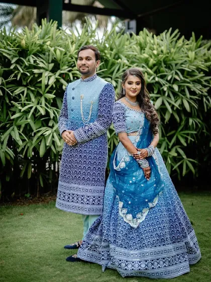 I believe a wedding is a celebration of two people, and their outfits should reflect that harmony. Here's a custom designed couple twinning lehenga and sherwani set in a striking blue, created to make sure they shine together.