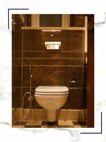 A clean and modern wall-mounted toilet. This design not only looks sleek but also makes the bathroom easier to clean. The checkered floor pattern adds a classic touch.