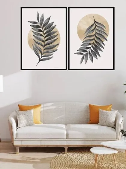 A serene set of two framed prints, each featuring a single leaf against a sun-like circle. The simple composition and neutral color palette make this an elegant and calming addition to your decor.