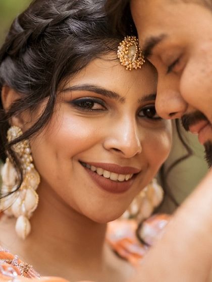 A beautiful close-up of the bride, showcasing her flawless smile and glowing skin.