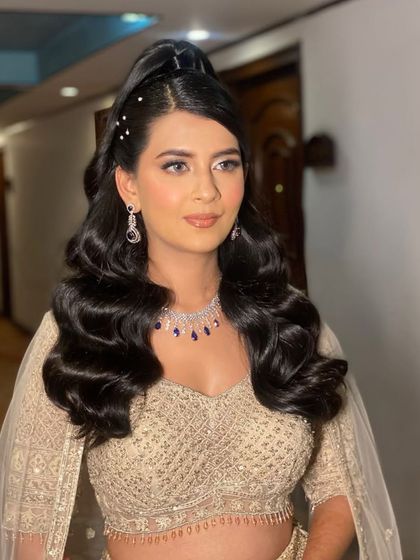 That top knot wave look for my bride. This is a modern and chic hairstyle for a reception or cocktail party.