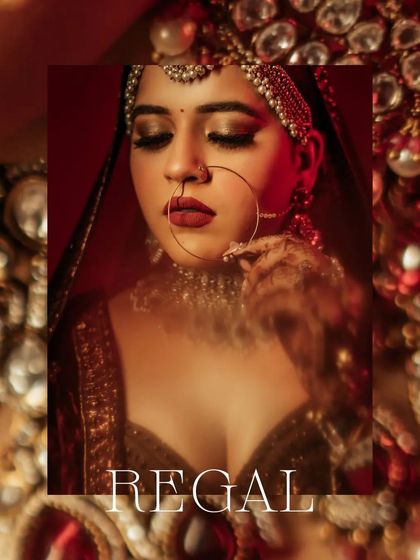 A regal, moody portrait of Vanshita, her face partially in shadow, her expression powerful and her jewelry shining.