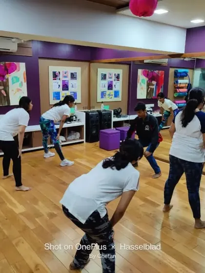 A group of women learning warm-up and conditioning exercises essential for self-defense. Our sessions are designed to be engaging and practical, ensuring everyone can participate regardless of their fitness level.