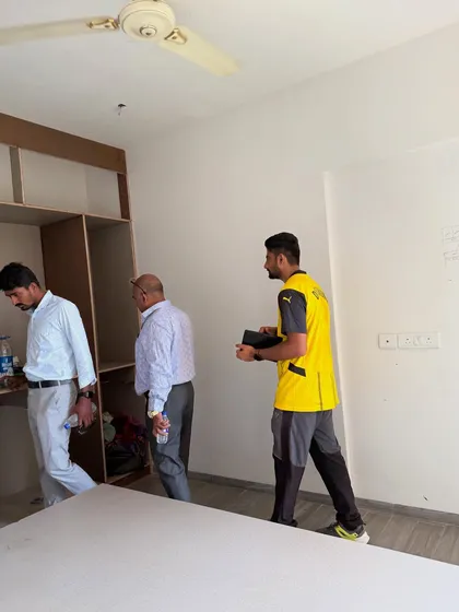 Walking through the site with my team and clients to review the progress of the bedroom furniture.