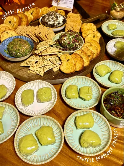 For hosts who want to impress, these are my go-to gourmet party starters. The platter includes my signature cheese domes, like cranberry jalapeño and truffle mushroom, served with a variety of crackers. Alongside are my creamy truffle edamame pockets, paired with a sweet and spicy chilli cashew onion jam.