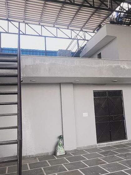 The rooftop access area of the commercial building prior to panel installation. We conduct thorough site evaluations to plan the most effective and safe installation strategy for every project.