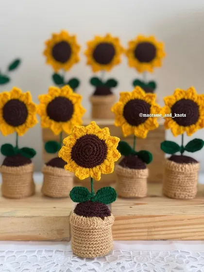 I created these little potted sunflowers as wonderful return gifts for parties and events. Each one is handmade and sits in its own tiny crochet pot, a perfect keepsake for guests to take home.