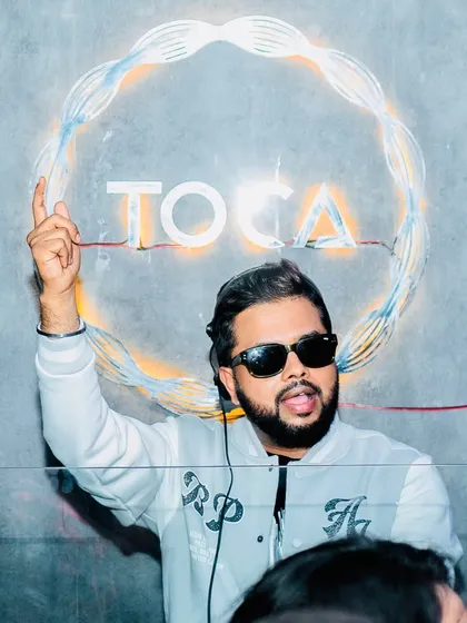 Glimpses of a Saturday night extravaganza at Toca Koramangala. I'm pointing to the sky, signaling the start of a great party.