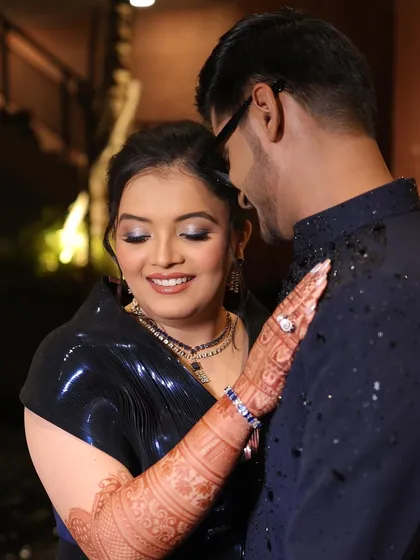Another beautiful couple portrait. The focus is on her glowing skin and dramatic eyes, a perfect combination for an evening celebration.