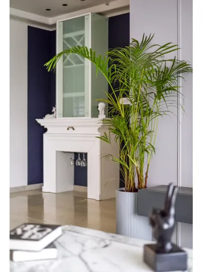 The fireplace-inspired bar unit, seen from the living room sofa. It's a perfect example of how we integrate functional pieces into the design in a way that is both beautiful and unexpected.