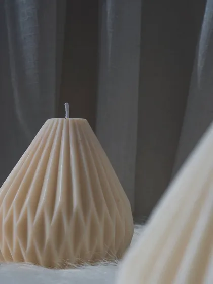 A close-up of our pear-shaped candle. The detailed geometric design makes it a true work of art.