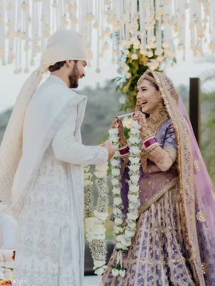 The jaimala ceremony is always full of fun and laughter. This shot captures the playful interaction between Yash and Riti during their varmala exchange at their beautiful Udaipur wedding.